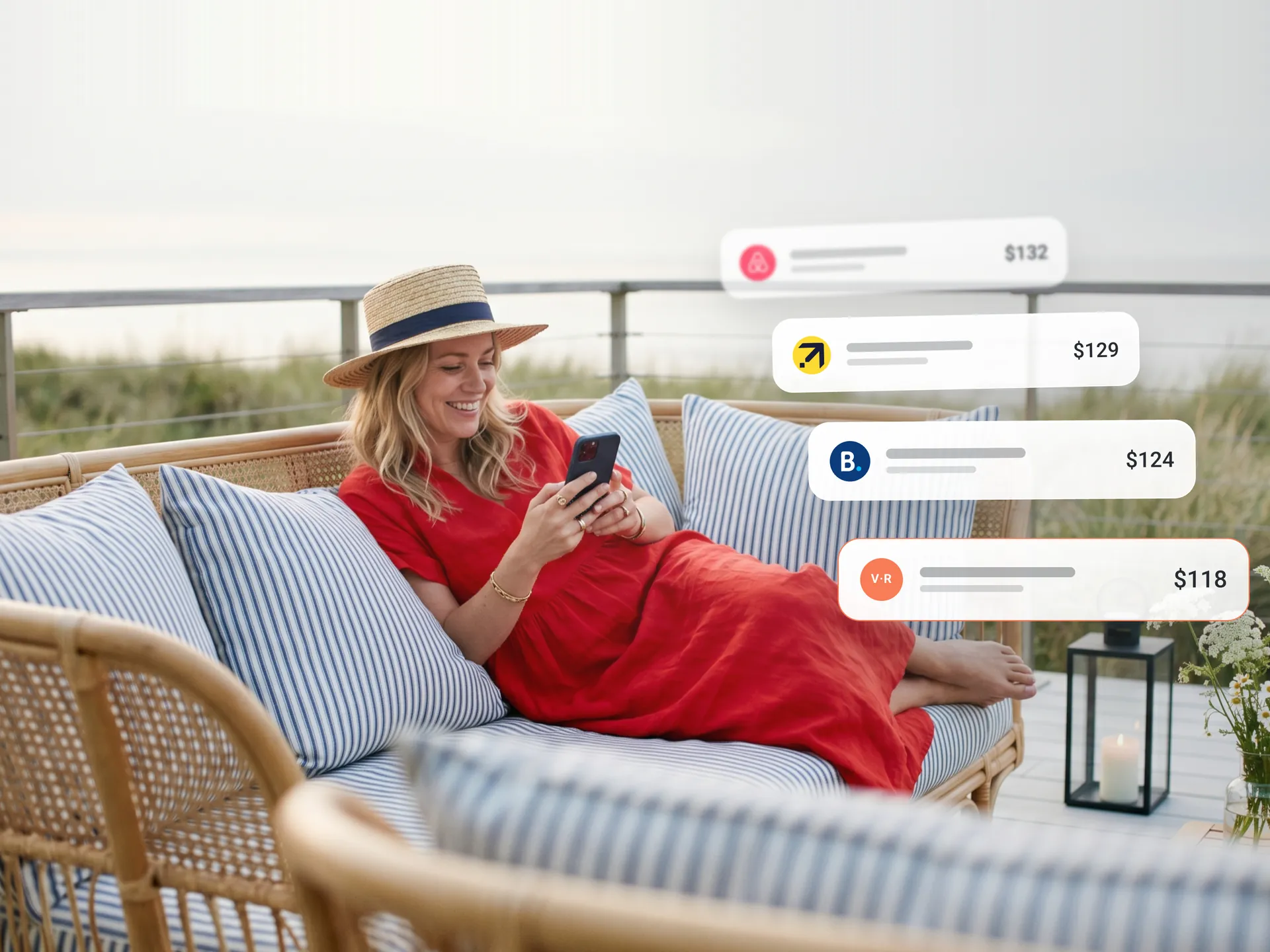 A traveller relaxing on a terrace, comparing accommodation prices on her phone