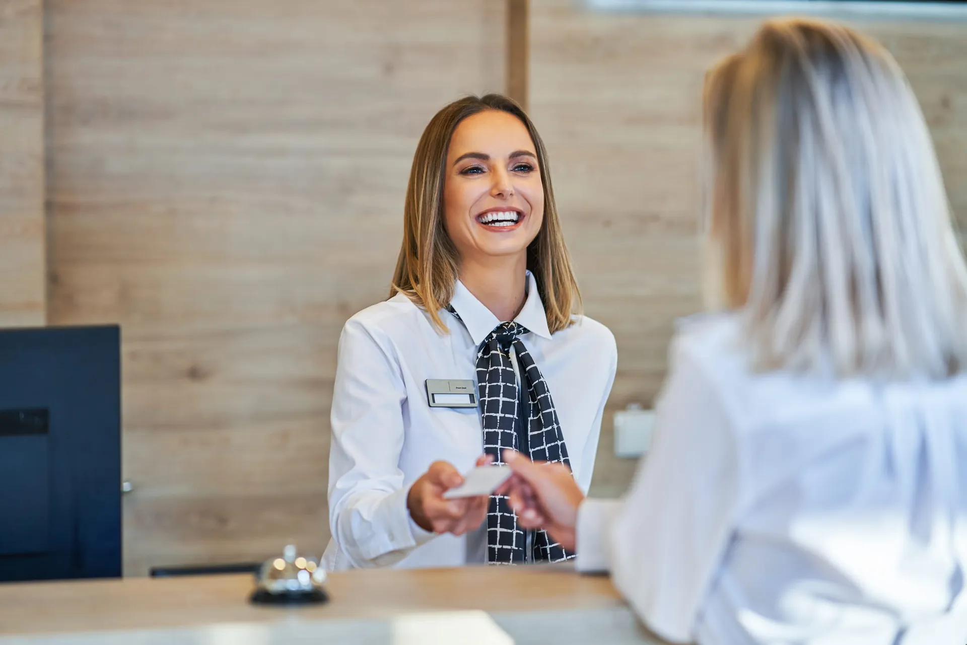 Guest paying with a card at reception